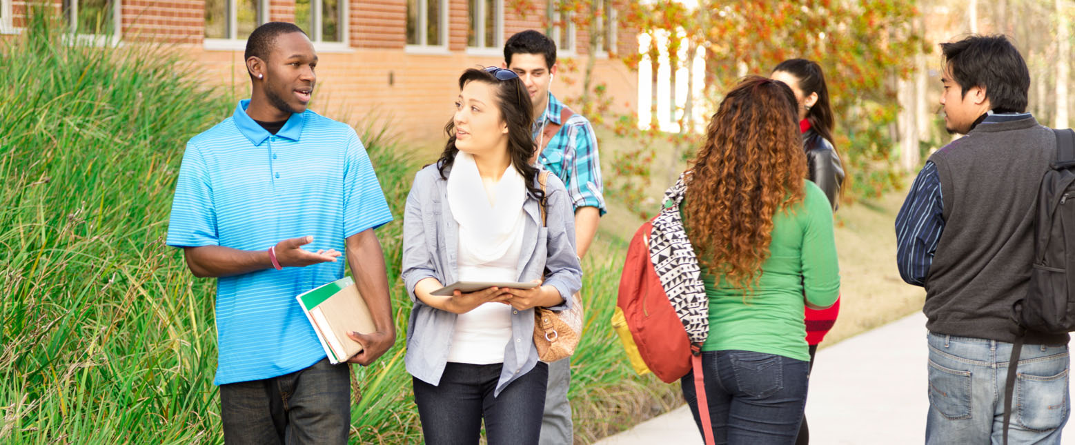 Students walking around a college campus