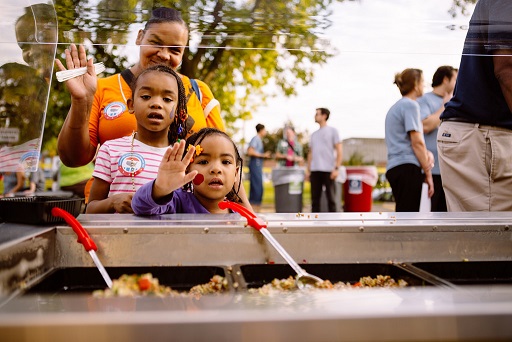 Families saying hi while they get food. 