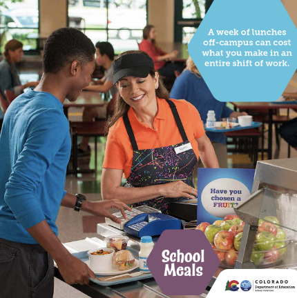 Student with food tray using keypad with help of cashier in school cafeteria