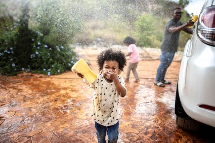 Family washing car